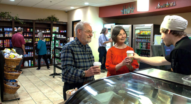 Staff Serving Residents at the General Store